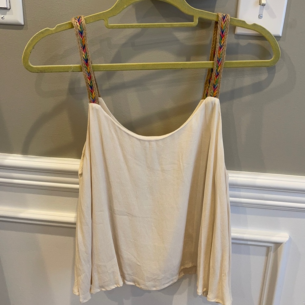 Flowy tank top. A little shorter but not crop